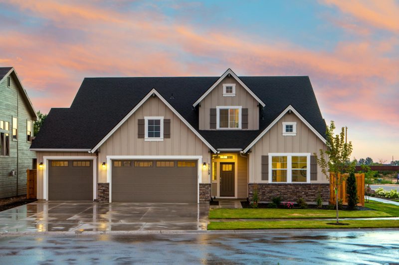 Home 3 Charming modern family home with a spacious garage in a suburban setting.